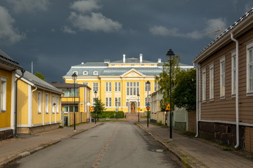 Canvas Print - Street view of the old town of Raahe. Central school at the end of the road was build in 1912.