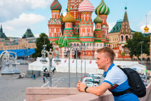 Portrait Of A Man Blond Tourist On A Sunny Day Against The Background Of The Kremlin In Moscow