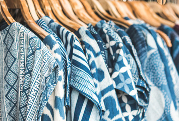 Selective focus 
Tie Dye Shirts in blue and white  Clothing Hanging On rack