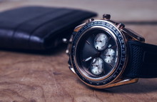 Business Wristwatch On The Wooden Table
