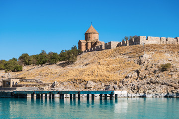 Cathedral of Holy Cross & wharf for tourist boats on Akdamar island, Van Lake, Gevaş, Turkey. It's popular tourist sight near Van. Monastery built in 921. It's masterpiece of medieval architecture