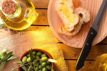 Sticker - Slices of bread with oil on wooden table countryside detail