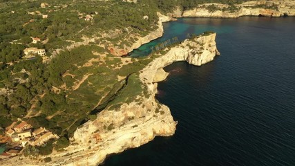 Canvas Print - flying a drone over the Bay of Caló del Moro Mallorca Spain