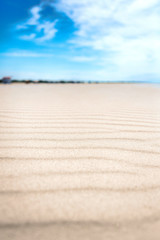 Calm day on abandoned white sand beach.