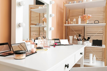 Canvas Print - Table with decorative cosmetics and mirror in modern makeup room