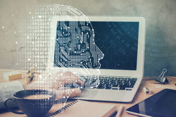 Wall Mural - businessman with computer background with brain theme hologram. concept of brainstorm. multi exposur