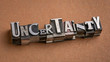 uncertainty word abstract in gritty vintage letterpress metal types, mixed fonts, unknown and doubt concept