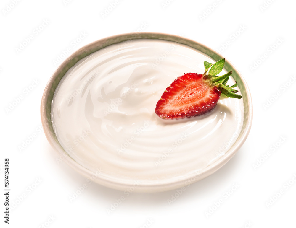 Bowl of healthy strawberry yogurt on white background