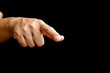 © Anucha - closeup of hand man pointing at something on black background,Success target businessman hand pointing target corporate future growth plan.