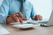 © PaeGAG - Business accounting, Businessman using calculator with budget document, computer laptop and in office, Savings, finances, and economy concept.