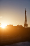 Fototapeta Boho - Cityscape of Paris, France and famous landmark Eiffel tower in silhouette just before sunset.