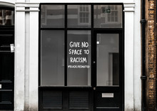 Racism & Black Lives Matter Sign On Shop Window In London, UK