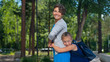 © Михаил Решетников - Excited schoolgirl hugs mom behind her back. The girl missed her mother very much.