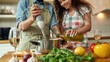 © Svitlana - Cropped shot of man, chef cook using hand blender while preparing a meal. Young woman, girlfriend in apron pouring olive oil in the pot, helping him in the kitchen