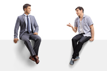 Canvas Print - Casual guy talking to a man in a suit and tie and sitting on a panel