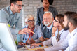 © ivanko80 - Group of people work in office.