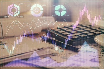 Double exposure of financial chart drawings and desk with open notebook background. Concept of forex market