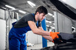 © Anna Kosolapova - Repairer opens the hood and checks the car engine