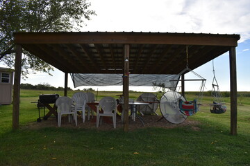 Wall Mural - Pavilion with Lawn Chairs and Picnic Tables