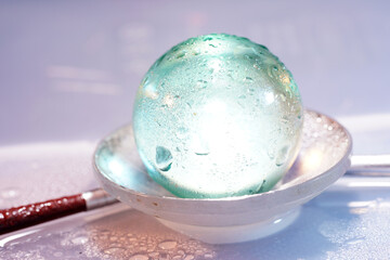 Sticker - Closeup shot of a glass ball in the bowl