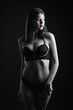 © Ivan Zelenin - Vertical view photo beautiful shy lady in lace bikini boudoir bra panties. Tender skinny slim shape isolated black background.