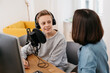 © contrastwerkstatt - Mother helping her young son with a podcast