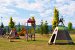 Empty children play park with slides and teepee tents