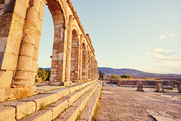 Wall Mural - Beautiful sunset lanscape. The ancient antigue roman city Volubilis in Morocco, Africa.