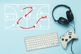 Fototapeta Do pokoju - Keyboard, headphones and gamepad on a blue background. Added drawing with the tactics of the game. Basketball. The concept of computer games, entertainment, gaming, leisure. Flat lay, top view.