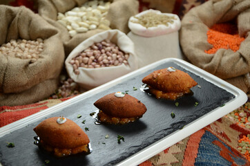 traditional turkish ottoman food in front of legume family sacks