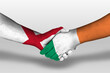 Handshake between ireland and england flags painted on hands, illustration with clipping path.