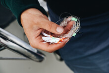 Closeup Focus Shot Of A Man Holding A Fishing Line With A Bait