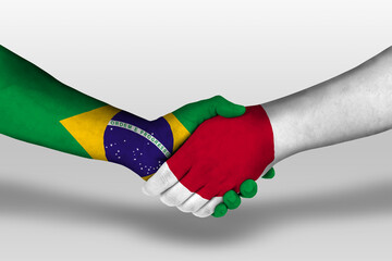 Wall Mural - Handshake between japan and brazil flags painted on hands, illustration with clipping path.