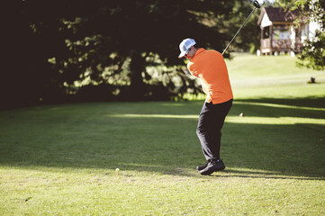 Canvas Print - Selective focus shot of a male playing golf