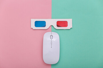 Pc mouse with anaglyph 3d glasses on a blue pink pastel background. Entertainment. Top view