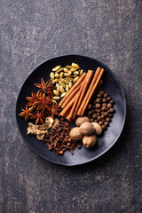 Wall Mural - Spices for Indian masala chai. Grey background. Top view.