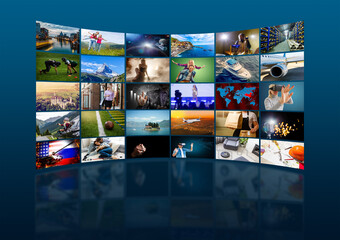 streaming concept. Close-up top view of a man watching videos on laptop. all screen graphics are made up.