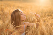 © alexkazachok - woman in wheat field at sunset