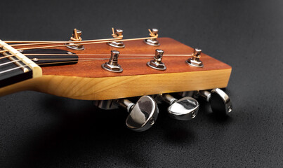 Wall Mural - Head of acoustic guitar  on black. Macro photo.