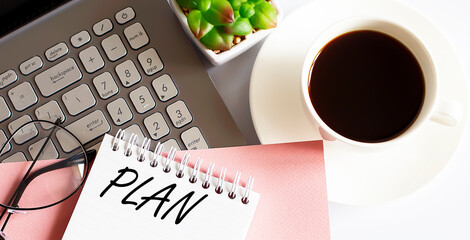 Poster - Office supplies, devices, coffee cup and glasses on the white table with text PLAN