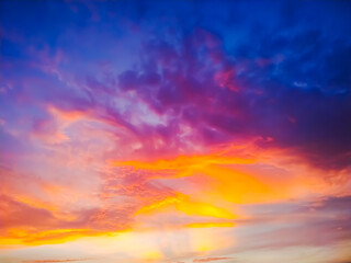 Wall Mural - sunset sky with clouds explosion and golden light at ocean ,long exposure