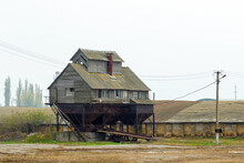 An Old Abandoned Ruined Granary, Grain Elevator. Rural Landscape.