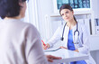 © lenets_tan - Medical consultation in a hospital. Doctor listening to a patient's problems