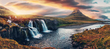 Amazing Mountain Landscape With Colorful Vivid Sunset On The Cloudy Sky Over The Famous Kirkjufellsfoss Waterfall And Kirkjufell Mountain. Iceland. Popular Location For Landscape Photographers.