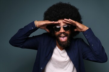 Wall Mural - Beautiful afro man in front of a colored background