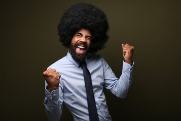 Wall Mural - Beautiful afro man in front of a colored background