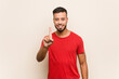 © Asier - Young south-asian man showing number one with finger.