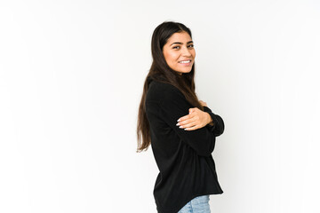 Wall Mural - Young indian woman isolated on purple background laughing and having fun.