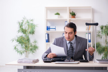 Young male employee after accident at workplace