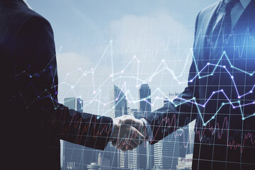 Double exposure of forex graph hologram and handshake of two men. Stock market concept.